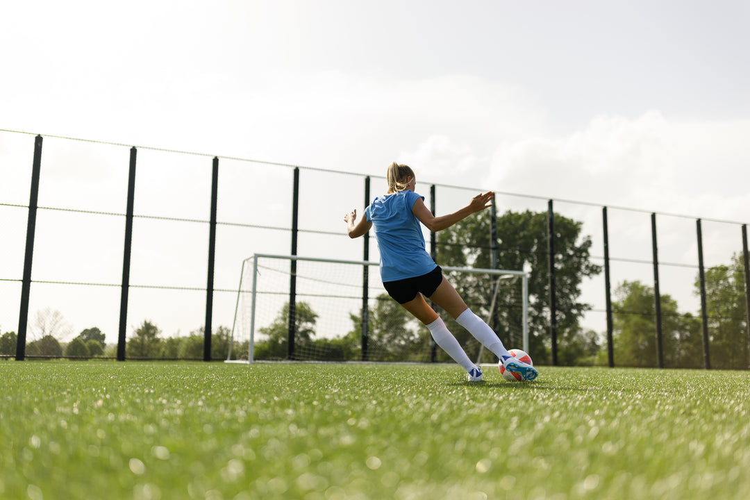 Girl shoots at goal