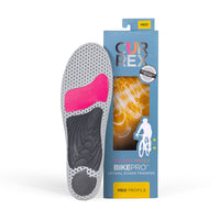 CURREX BIKEPRO insole with gray, red and black base next to blue box with yellow insole inside #1-wahle-dein-profil_med