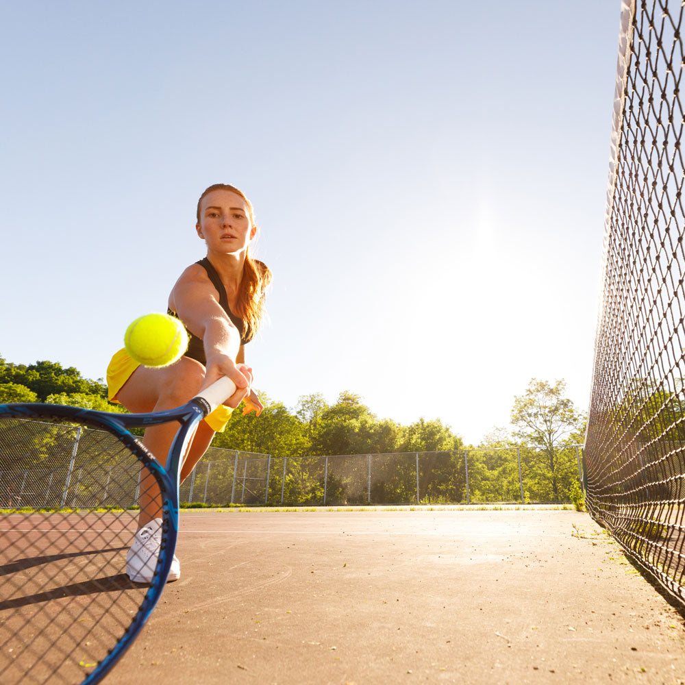 Woman playing tennis, hitting tennis ball with tennis racquet #1-wahle-dein-profil_low