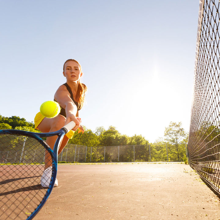 Woman playing tennis, hitting tennis ball with tennis racquet #1-wahle-dein-profil_med