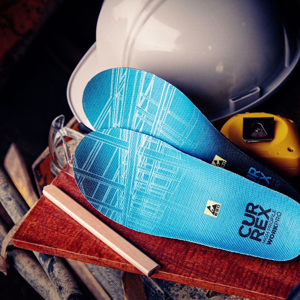 CURREX WORK blue high profile insoles next to safety helmet and measuring tape #1-wahle-dein-profil_high